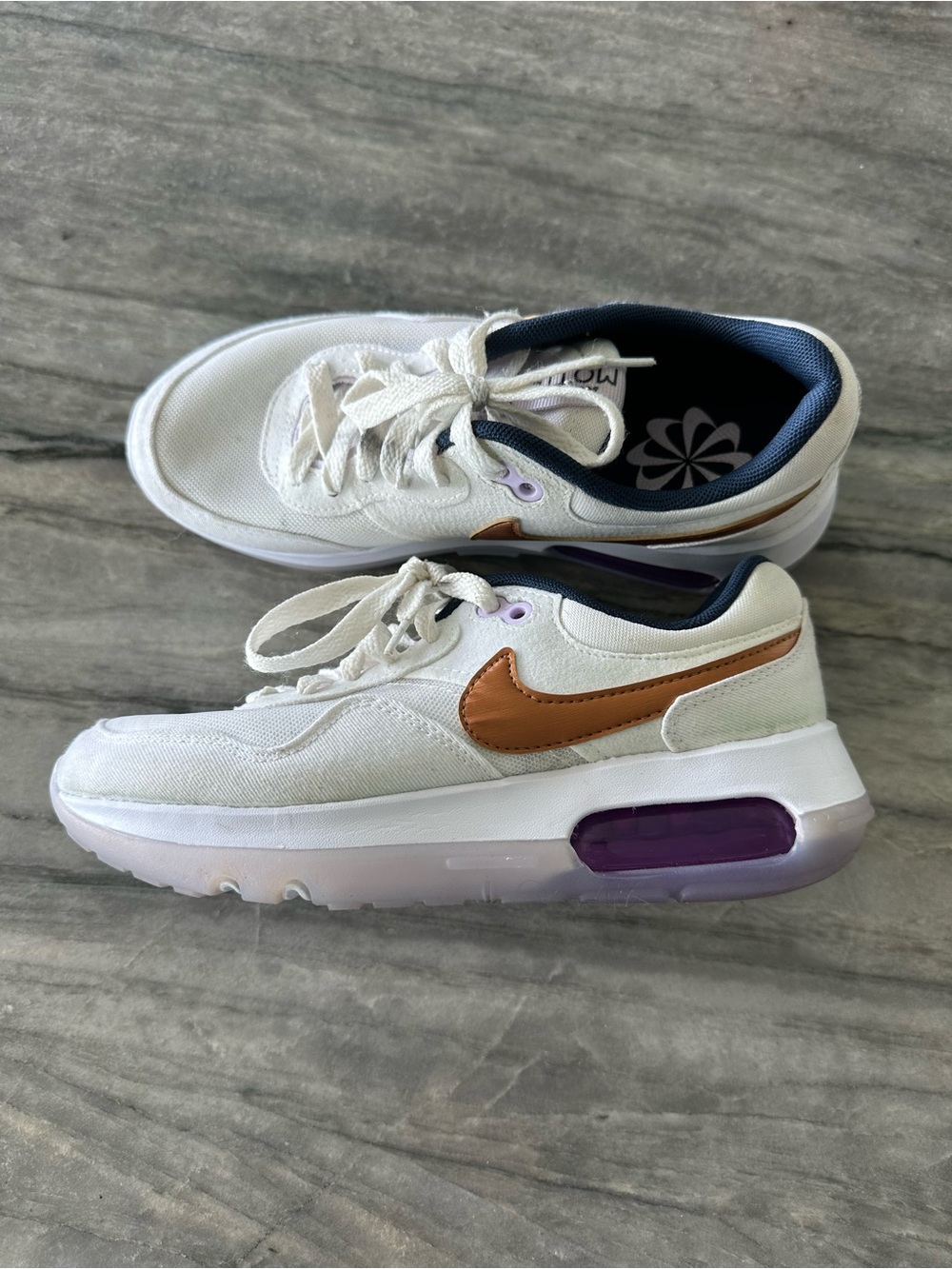 Nike Navy and White Kids' Sneaker with gold brown Swoosh and Purple Accent